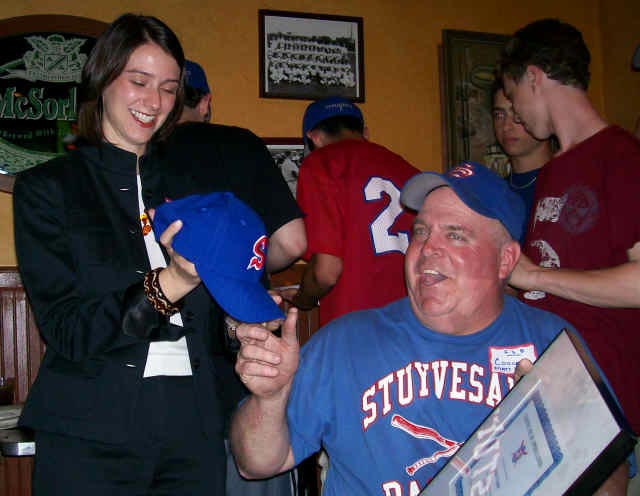 Coach Matt Hahn awards Jessica Lappin a Stuy team hat ....